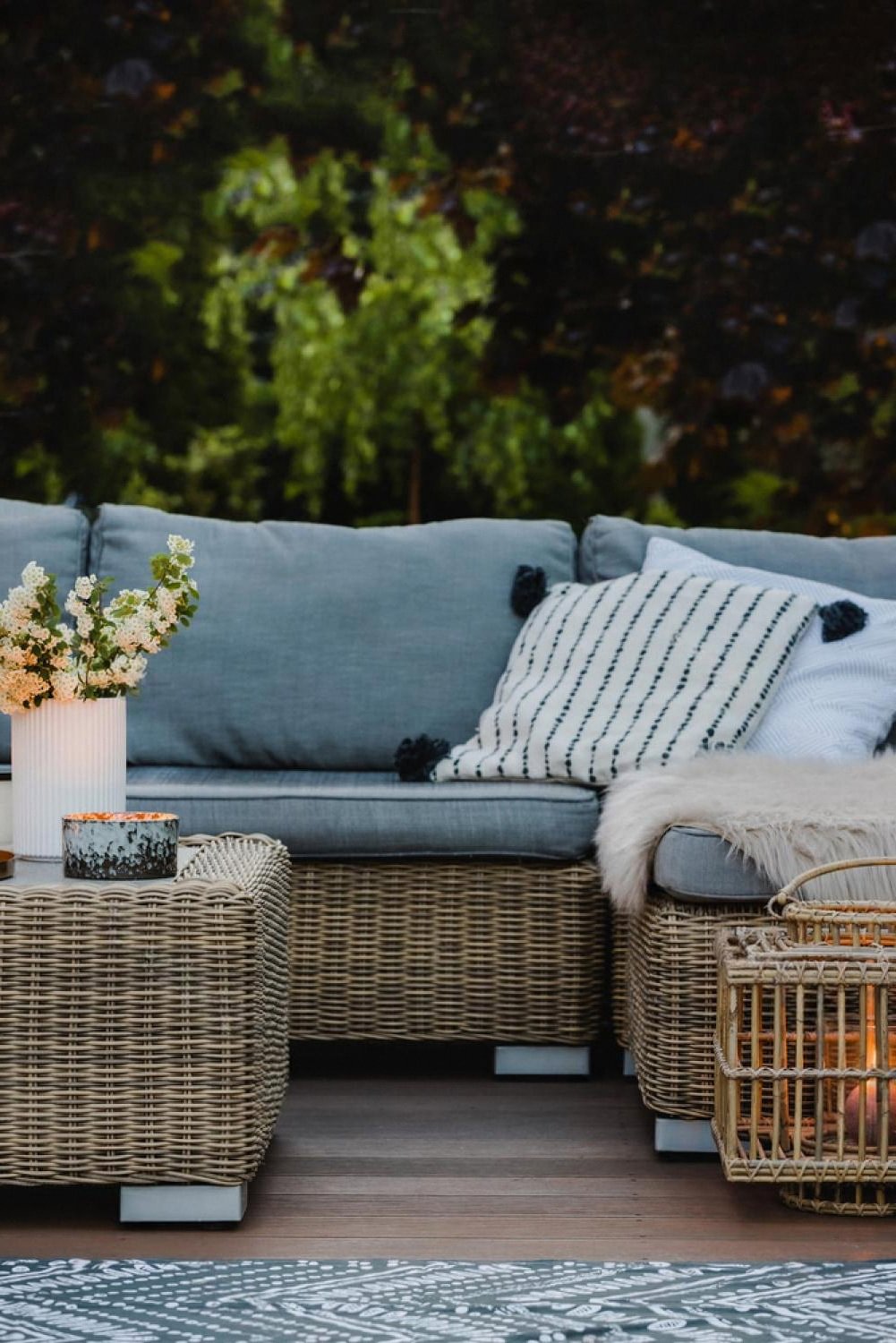 Outdoor lounge sofa arrangement with cushions and side tables for a Dubai event